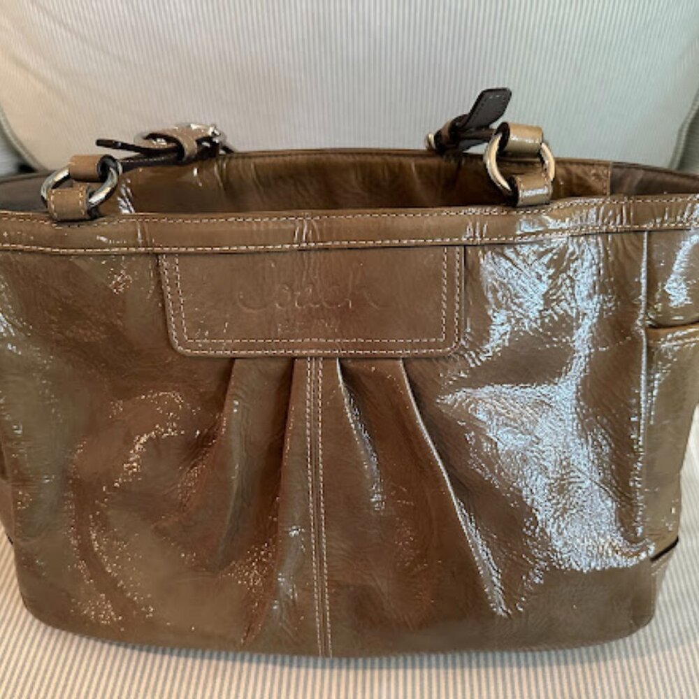Coach handbag Shiny, light brown/putty colored with silver hardware.